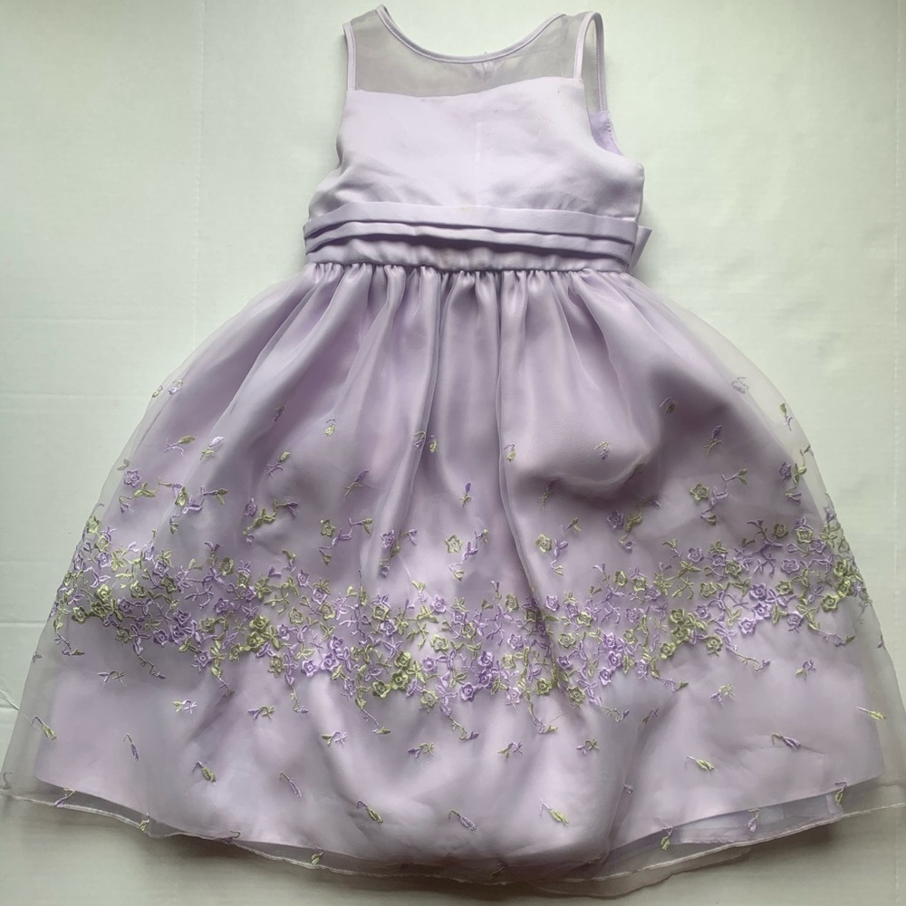 A purple dress with green and purple flowers